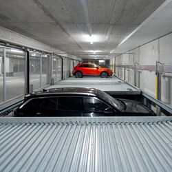 The car moves down one level in the parking system