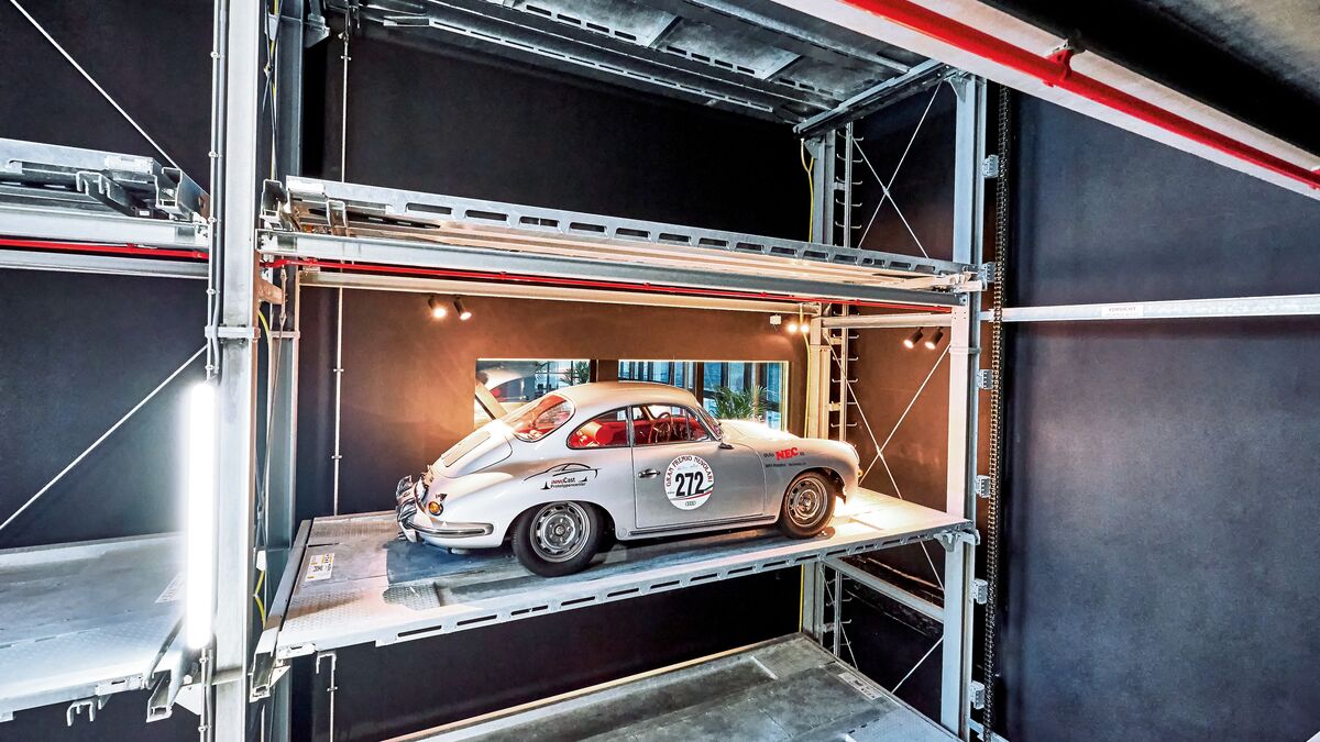 The car is parked in a shelving system